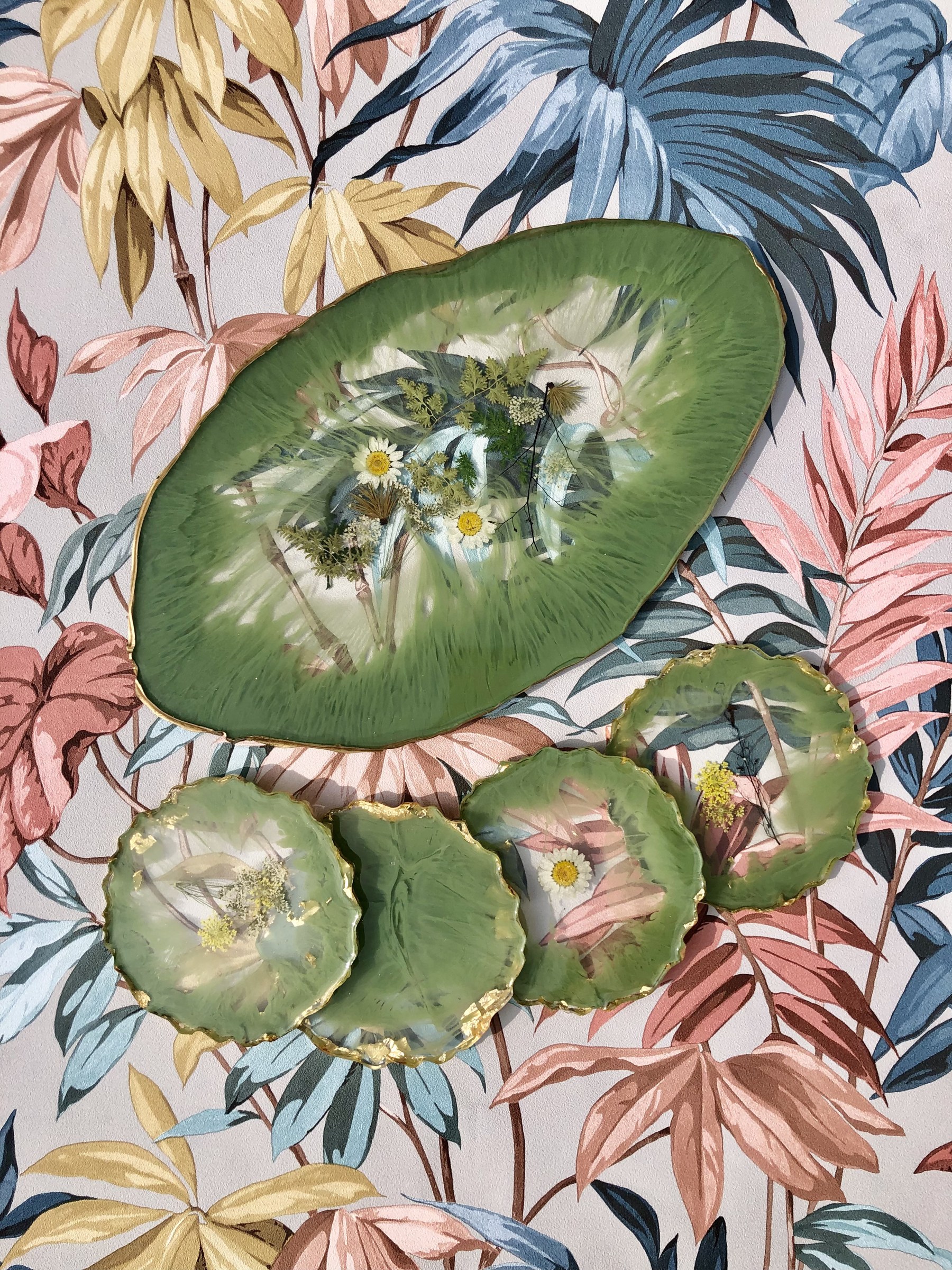 Green resin platter and coasters with pressed flowers on floral backdrop